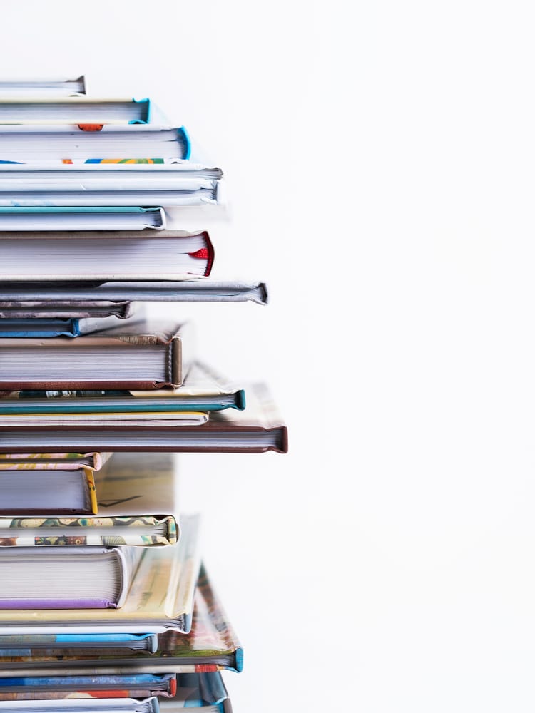 Close,View,Of,Stack,Of,Children's,Books,On,A,White
