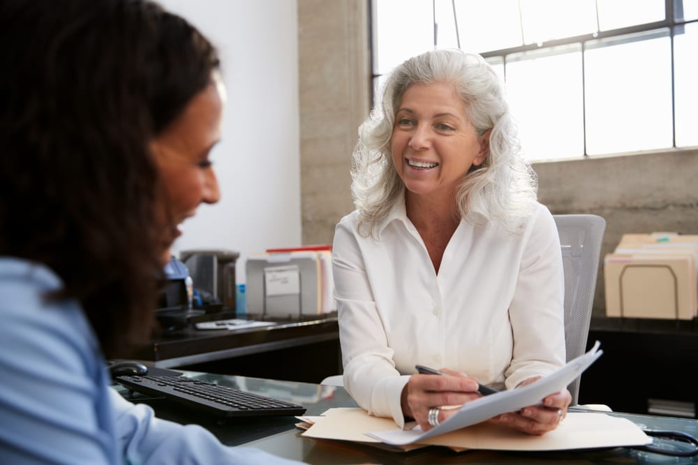 professional senior woman in meeting with young lady